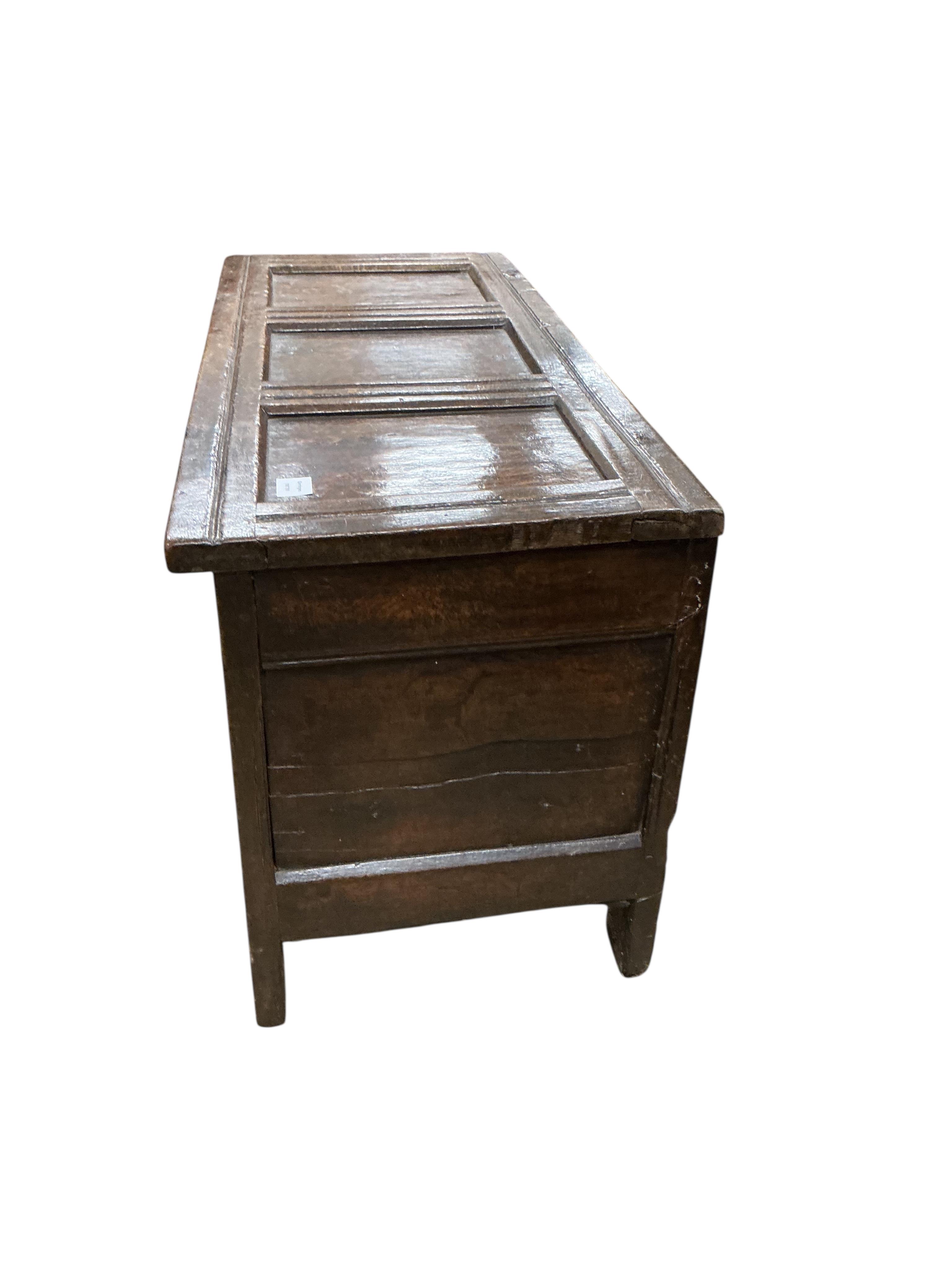 A small 17th century oak triple panelled coffer, width 106cm, depth 46cm, height 59cm